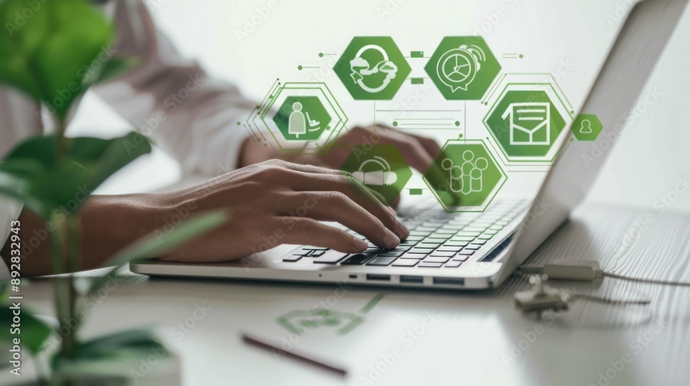 Poster a closeup of hands typing on a laptop with green technology icons hovering above
