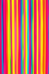 Fototapeta premium Abstract background formed by colorful wavy vertical stripes, creating a vibrant and dynamic composition. The bright colors and flowing lines evoke a sense of energy and movement