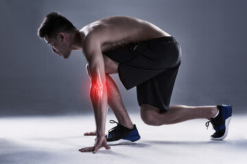 Man, elbow and injury of exercise in studio, arm anatomy and xray for diagnosis. Red glow, skeleton and person ready for running with inflammation of muscle or tension, arthritis and gray background.