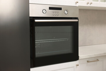 Fototapeta premium New electric oven in kitchen. Cooking appliance