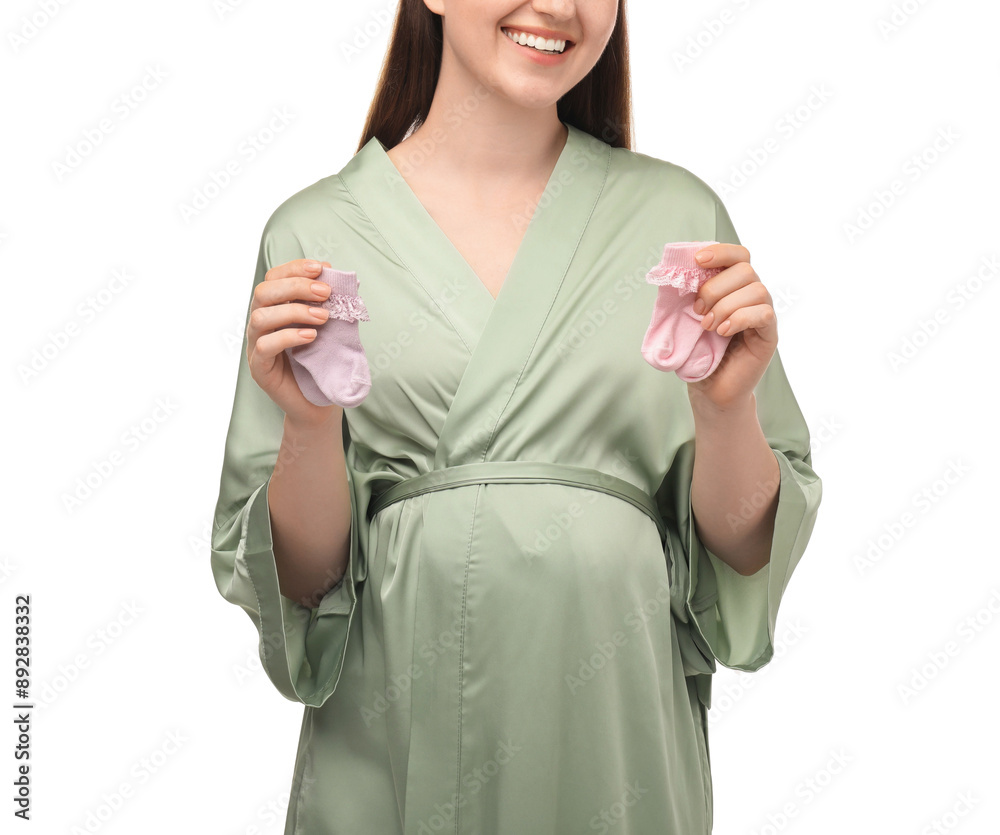 Sticker Expecting twins. Pregnant woman holding two pairs of socks on white background, closeup