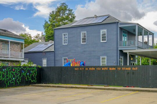 NEW ORLEANS, LA, USA - JULY 5, 2024: Parking Lot and Fence, with Inspirational Message, for Chartwell Center, a Non-profit School for Children and Young Adults with Autism
