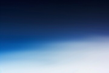 Obraz premium Blurred gradient background transitioning from dark blue to white, perfect for various uses like backdrops, digital art, and websites