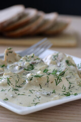 Tender chicken pieces draped in creamy dill sauce