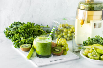 Fresh green fruit and vegetables for making a healthy green juice.