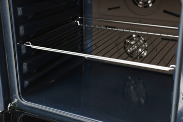 Obraz premium Open electric oven, closeup view. Cooking appliance