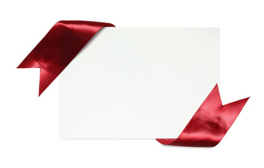Red satin ribbon and blank card isolated on white, top view