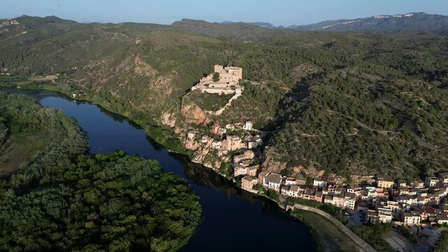 Miravet at Ebro riverbank, small town in Tarragona, Catalonia, aerial view