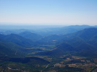 Panorama of a green mountain under cloudy skies in the south of France