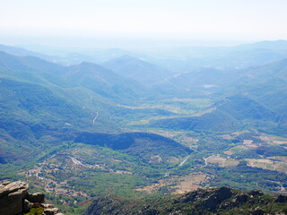 Panorama of a green mountain under cloudy skies in the south of France