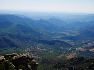 Panorama of a green mountain under cloudy skies in the south of France