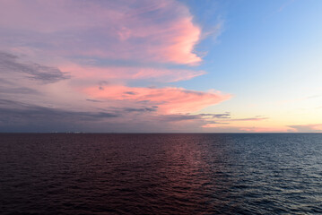 Golden sunset and dramatic clouds over Atlantic Ocean