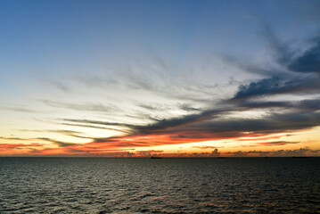 Golden sunset and dramatic clouds over Atlantic Ocean