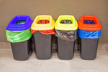 multi-colored containers for sorting waste. Ecology and technology