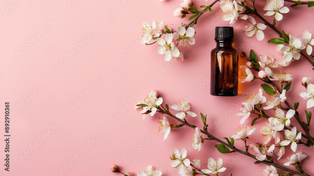 Sticker simple flat lay beauty concept with an empty bottle logo space body care therapy flower oil on pink 