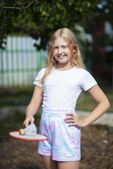 Girl playing badminton outside
