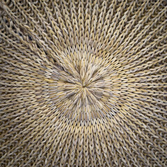Woven material background texture radiating outward from a central point
