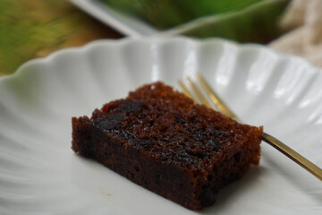 Kek Buah Kukus, a traditional Malaysian steamed fruit cake filled with dried fruits, nuts, and spices