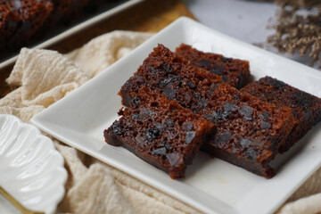Kek Buah Kukus, a traditional Malaysian steamed fruit cake filled with dried fruits, nuts, and spices