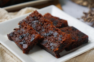 Kek Buah Kukus, a traditional Malaysian steamed fruit cake filled with dried fruits, nuts, and spices