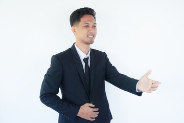 Adult Asian man wearing black suit and tie doing hand shake gesture for agreement