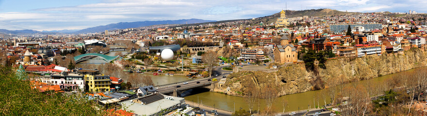 Beautiful view of Kura river and Bridge of Peace in Tbilisi, Georgia © JackF