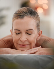 Calm, woman and sleeping in spa for relax, massage therapy and luxury for wellness on bed. Senior...