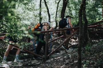 Group of hikers trekking through a dense forest on a nature trail, enjoying outdoor adventure and nature exploration.