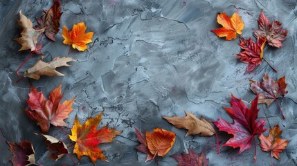 Autumn leaves arrangement on textured gray background Overhead view Fall theme with space for text