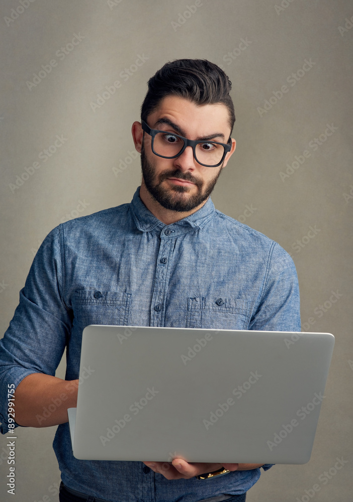 Poster shock, surprise and business man with laptop in studio with bad news, announcement and email mistake