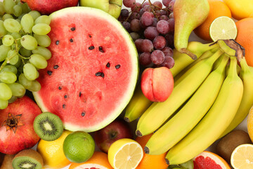 Many fresh ripe fruits as background, top view