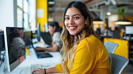 Smiling Woman Working at a Computer in an Office