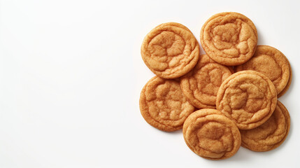 An image of classic snickerdoodle cookies, featuring golden-brown, slightly crinkled tops dusted with a generous coating of cinnamon sugar, set against a clean white background