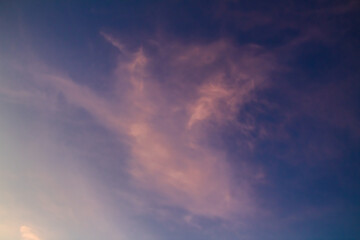 Clouds with warm light and blue sky in the afternoon