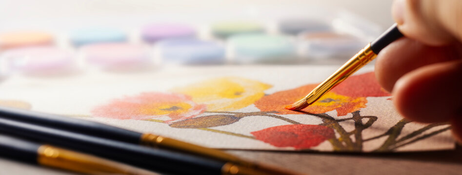 水彩画を描く人物