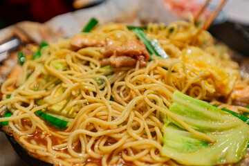 Close up shot of delicious chicken fried noodle