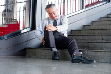 A man falls down the stairs and is injured.