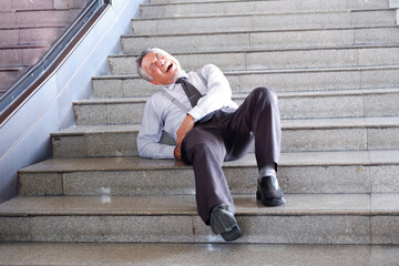 A man falls down the stairs and is injured. © krongthip