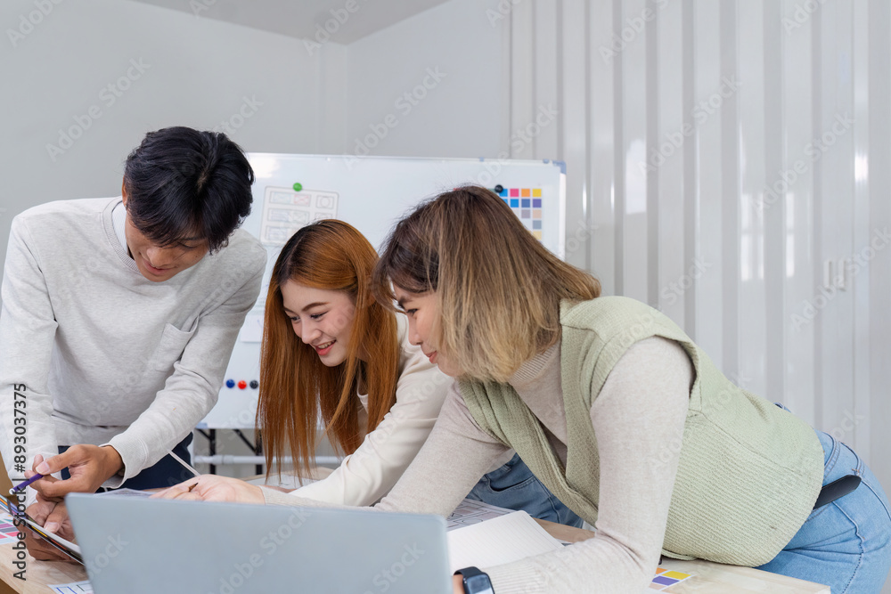 Wall mural collaborative ux ui design team working on creative project in modern office environment