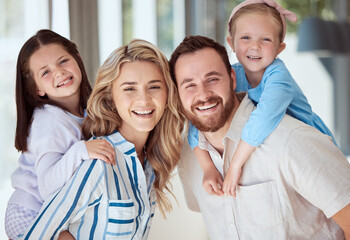 Obraz premium Parents, kids and piggy back in home for portrait, smile and bonding with care in family house. Father, mother and daughter siblings with love, happy and connection with games at apartment in Italy