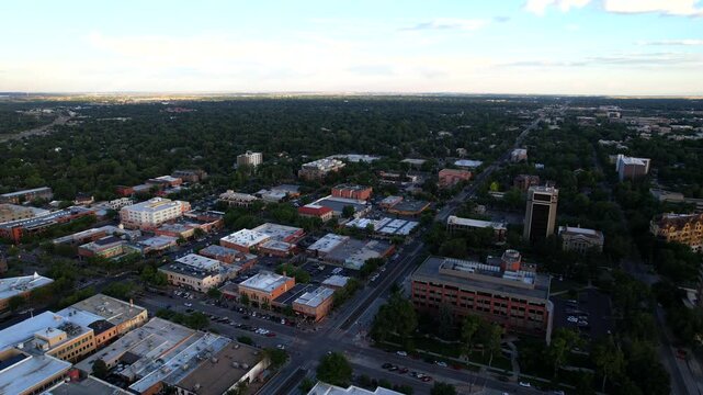Building and town of Fort Collins in Northern Colorado at Sunset- Drone Aerial Video