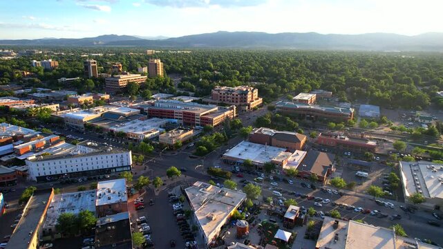 Golden Hour Aerial Drone Video of the American Town of Fort Collins Colorado with mountains in background