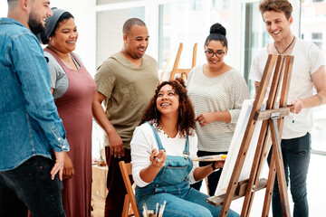 Creative, painting and artist with students in art class learning technique on canvas with easel....