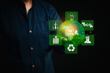 Person promoting Net Zero emissions with eco-friendly technology icons.