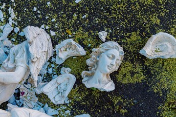 Broken bust of an angel statue smashed on the ashphat. Old Town, Albuquerque, New Mexico, United...