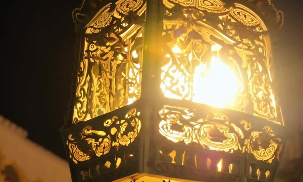 Golden lamp on the wall in an islamic sculptures
