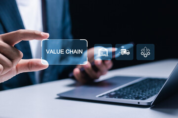 Value chain business concept. Businessman using laptop with value chain icon on virtual screen. Process of procuring raw materials until the product reaches the customer.