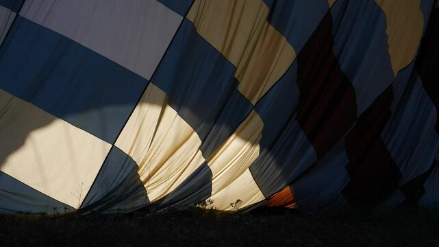 Hot Air Balloon Grounded Fabric Envelope Pattern Lighted by the Sun, Slowmotion