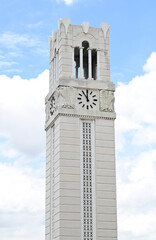Obraz premium Closeup of The Landmark of Clock Tower in the city with blue sky and white cloud background, Clear day and good weather in the morning, Thailand.