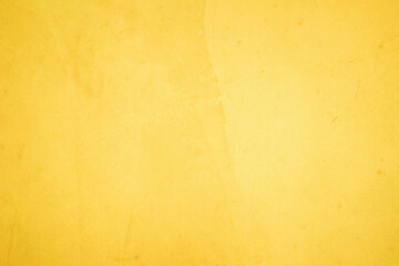 Yellow concrete stone texture for background in summer wallpaper. Cement and sand wall of tone vintage minimal. Concrete abstract wall of yellow color, cement texture white blank for home decor.